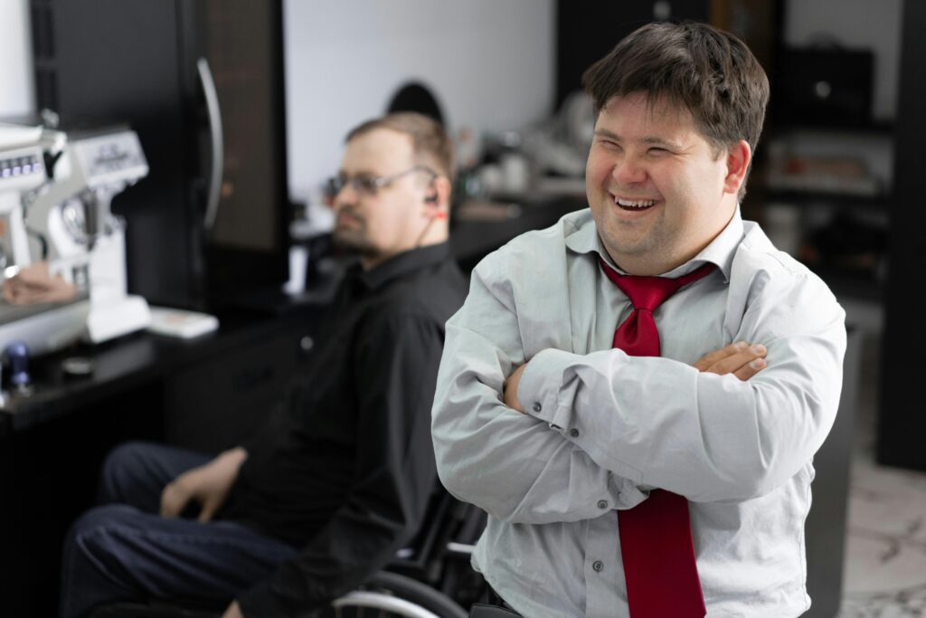 Smiling employee in office setting promoting inclusivity and diversity.